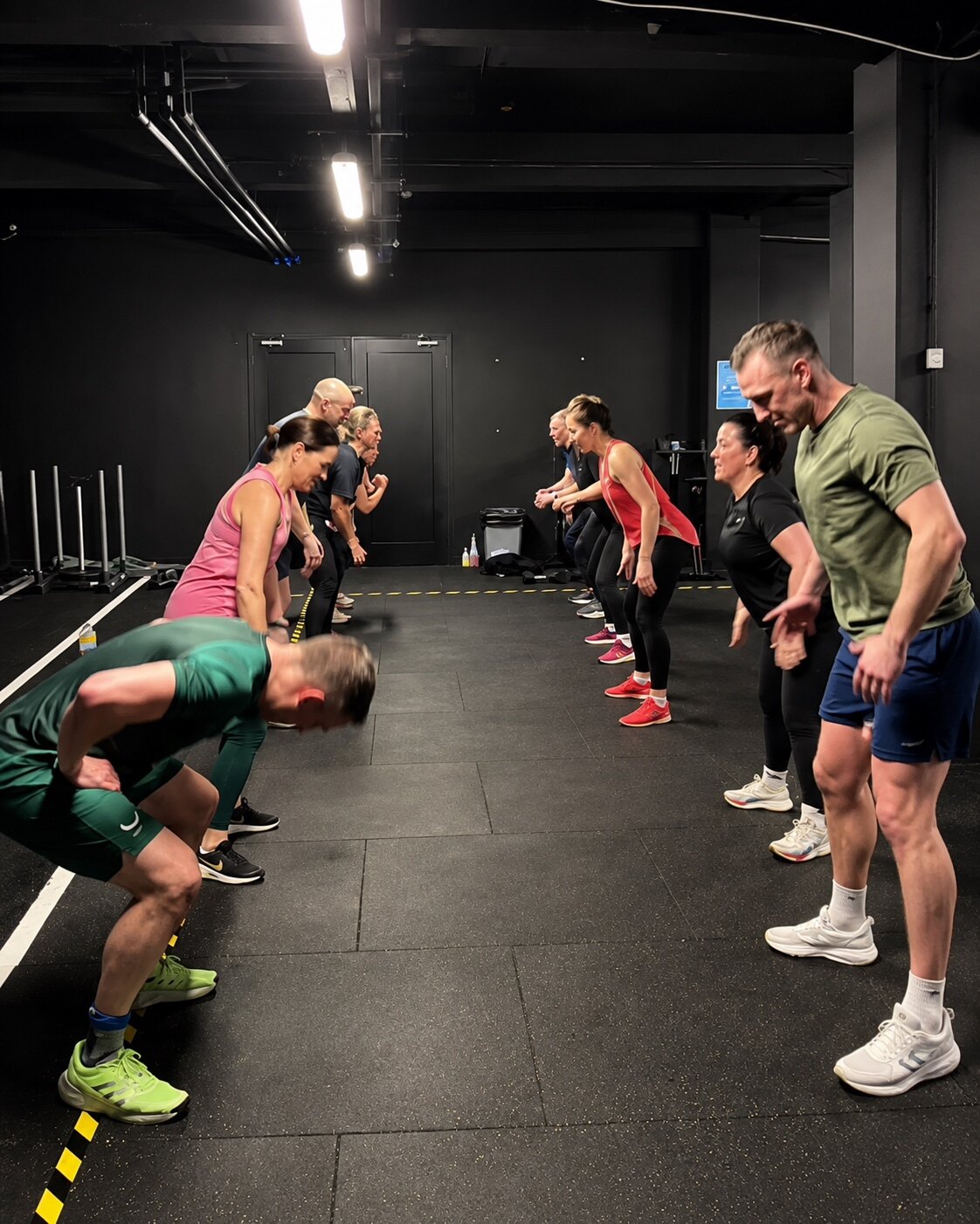 Adults completing a coached RITUAL group exercise at Loc'Down Training